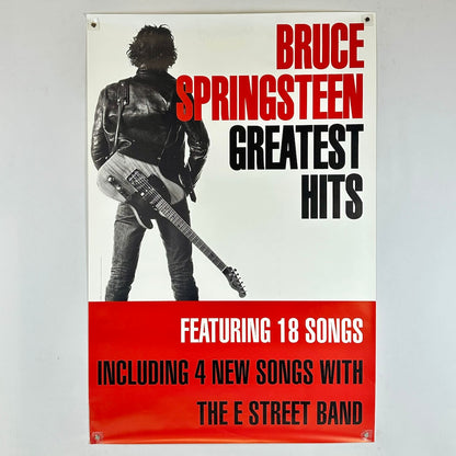 Poster of Bruce Springsteen with a guitar, featuring text about 'Greatest Hits' and new songs with The E Street Band.