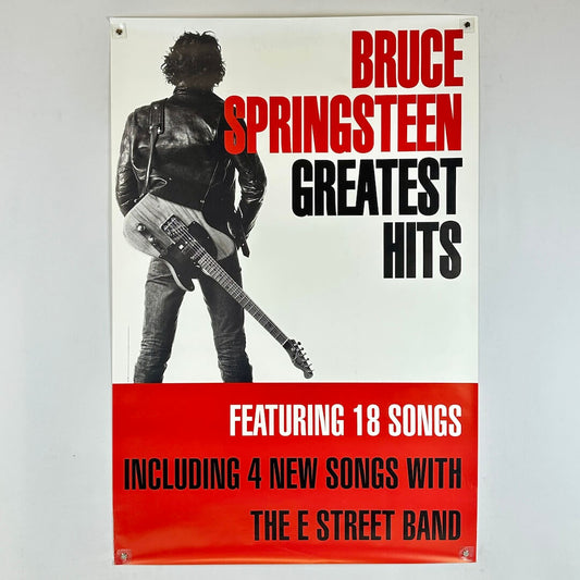 Poster of Bruce Springsteen with a guitar, featuring text about 'Greatest Hits' and new songs with The E Street Band.