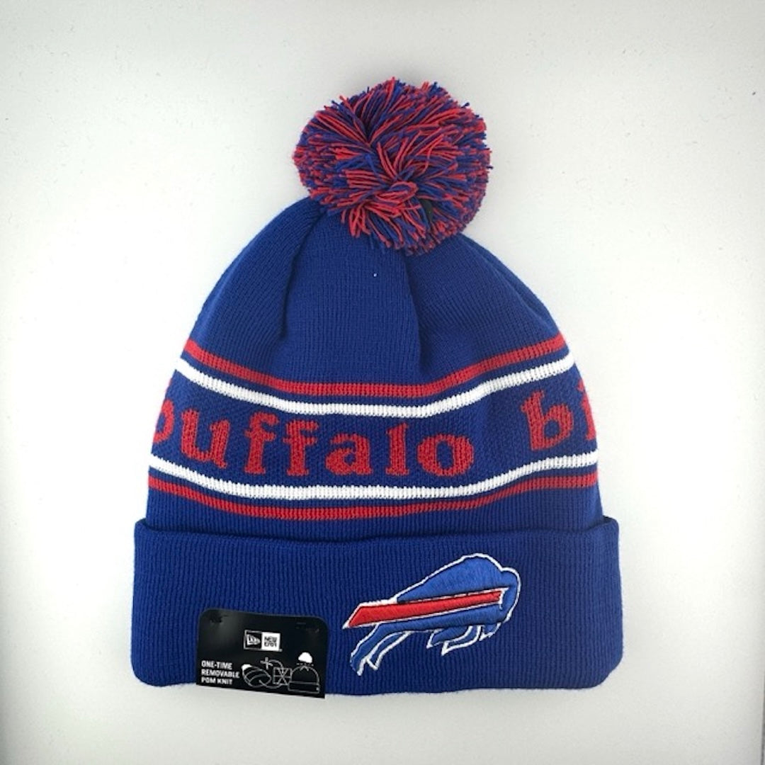 Blue knit cap with red/white stripes around red text, blue cuff with Bills logo front center & blue/red pom