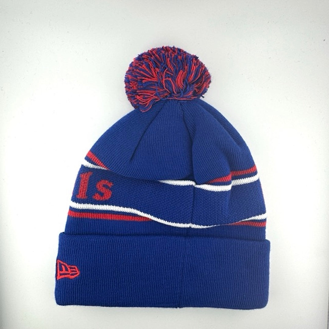 Blue knit cap with red/white stripes around red text, blue cuff with Bills logo front center & blue/red pom