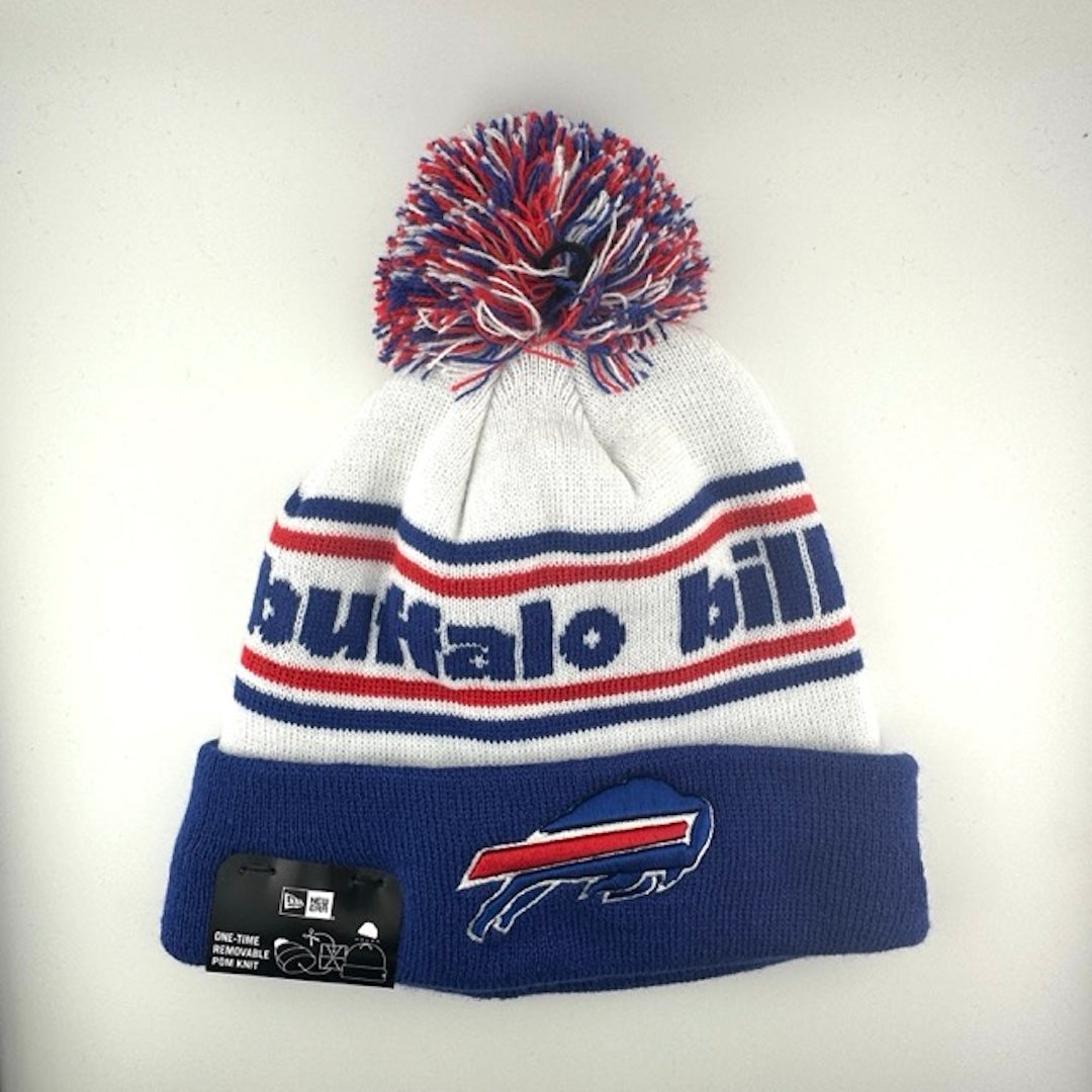 White knit cap with red/blue stripes around blue team name, blue cuff with Bills logo front center & blue/white/red pom atop