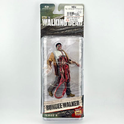 The Walking Dead Series 6 Bungee Walker action figure in its original packaging, featuring a detailed zombie character.