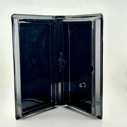Image of VHS case interior to show shiny black with no cracks or scratches.
