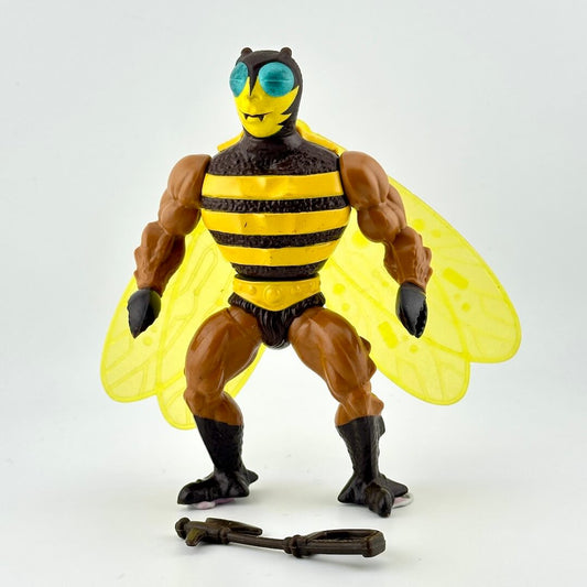 Toy figure of a bee-like character with yellow wings and striped body on a white background