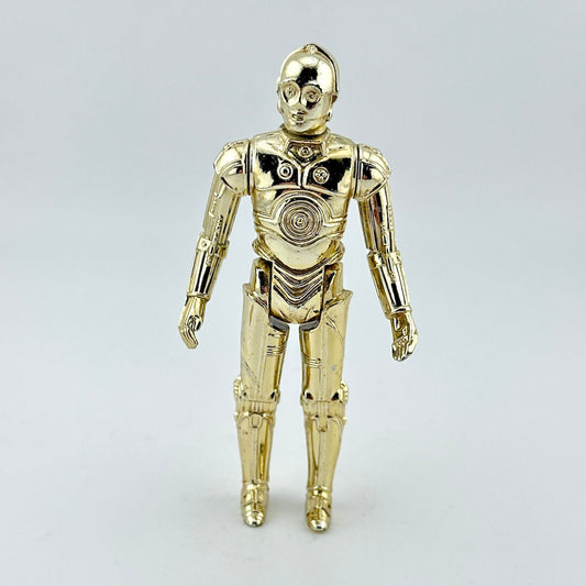 Gold robot toy figure on light gray background.