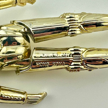 Close-up of back of figure's legs to show COO and copyright information. 