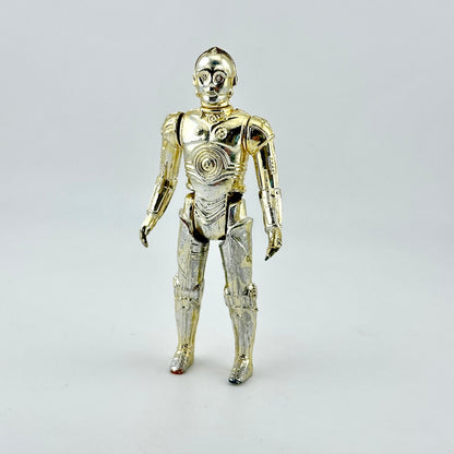 A metallic gold C-3PO droid action figure standing against a light gray studio background.