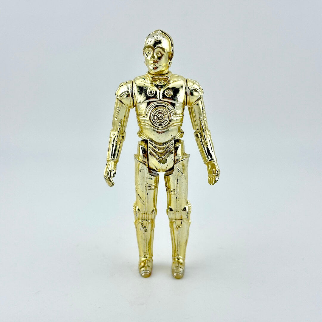 Gold robot figure on a light gray background