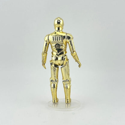 Gold robot figure on a gray background