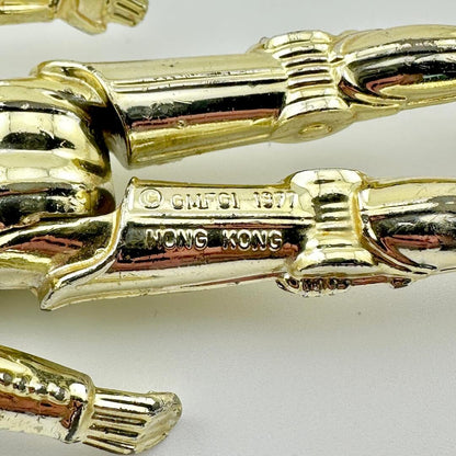 Close-up of back of figure's legs to show COO and copyright information. 