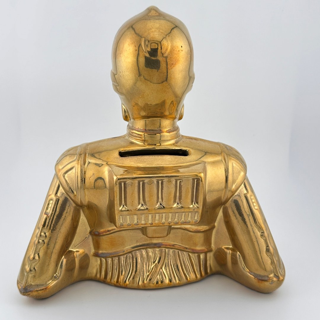 Metallic gold painted coin bank bust of droid, C-3PO reverse view. 