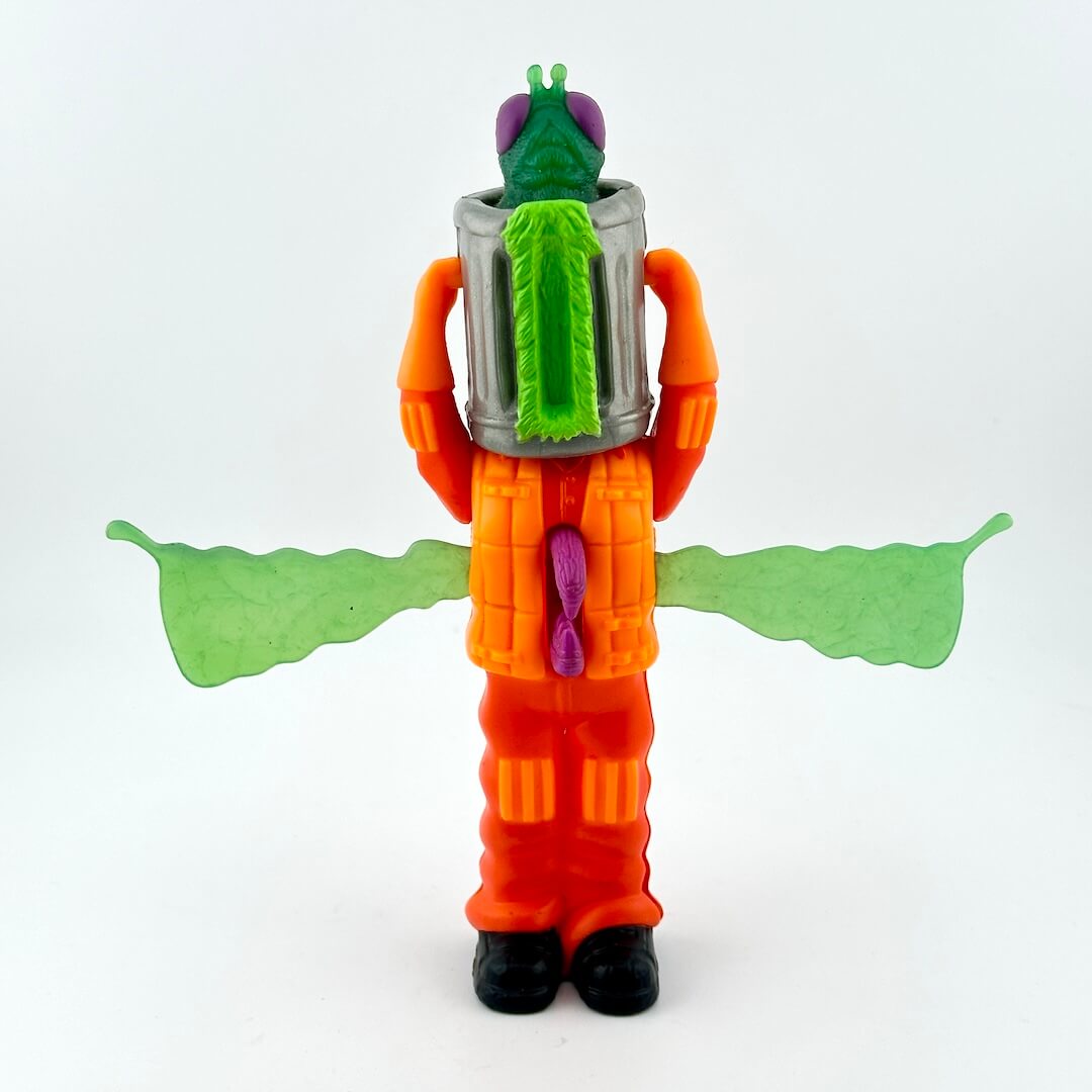 Toy figure with an orange suit, green head, and wings on a white background