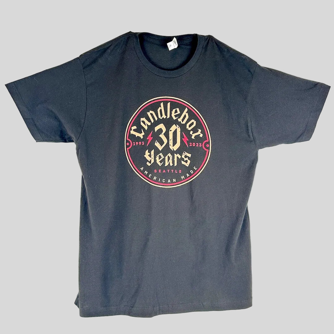 A black crewneck t-shirt with a circular graphic on the chest reading 'Candlebox 30 Years Seattle American Made' in cream and red.