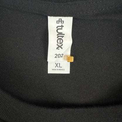 Close-up of a black knit garment neck label reading Tultex, size XL.