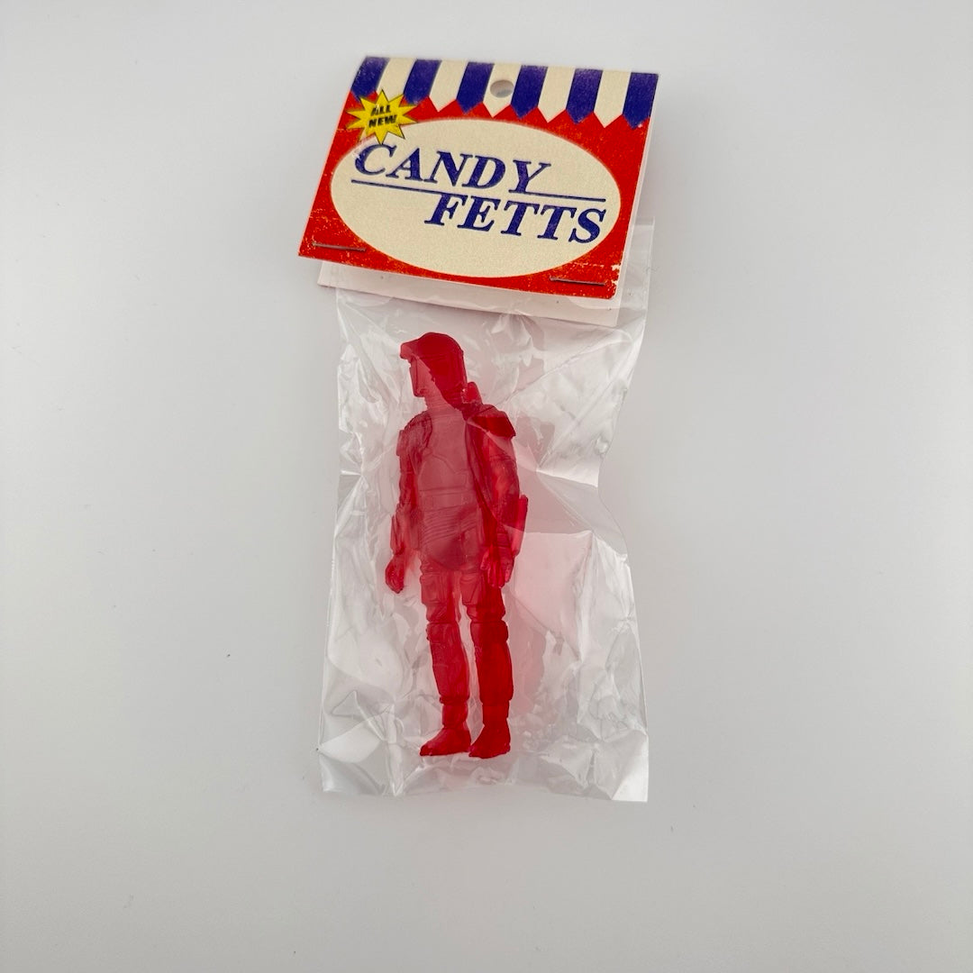 Red semi-transparent custom figure of Boba Fett classic action figure in packaging, clear plastic bag & card-stock tag.