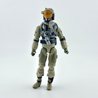 A toy action figure of a futuristic soldier in tan and gray armor with a glowing orange visor.