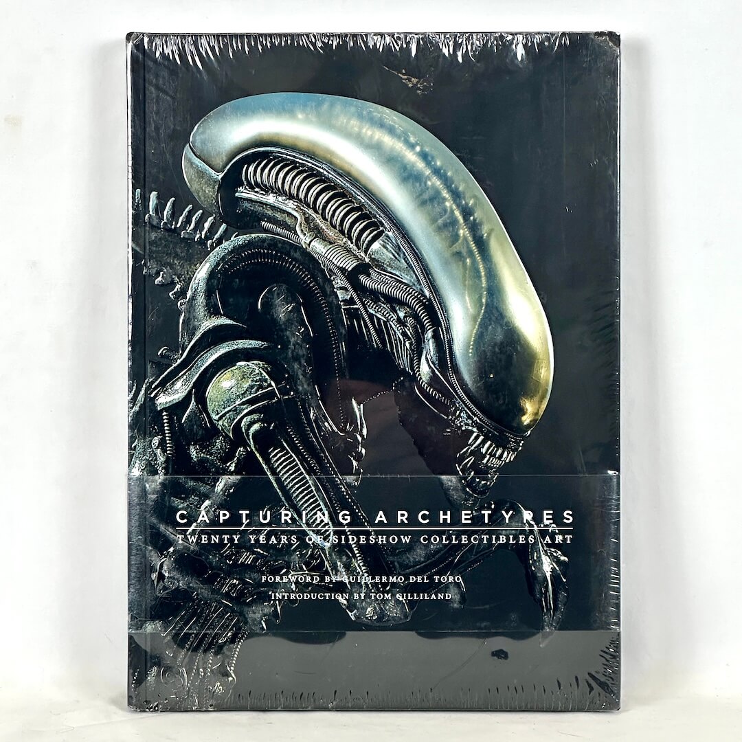 Book cover with a detailed alien design and text on a white background