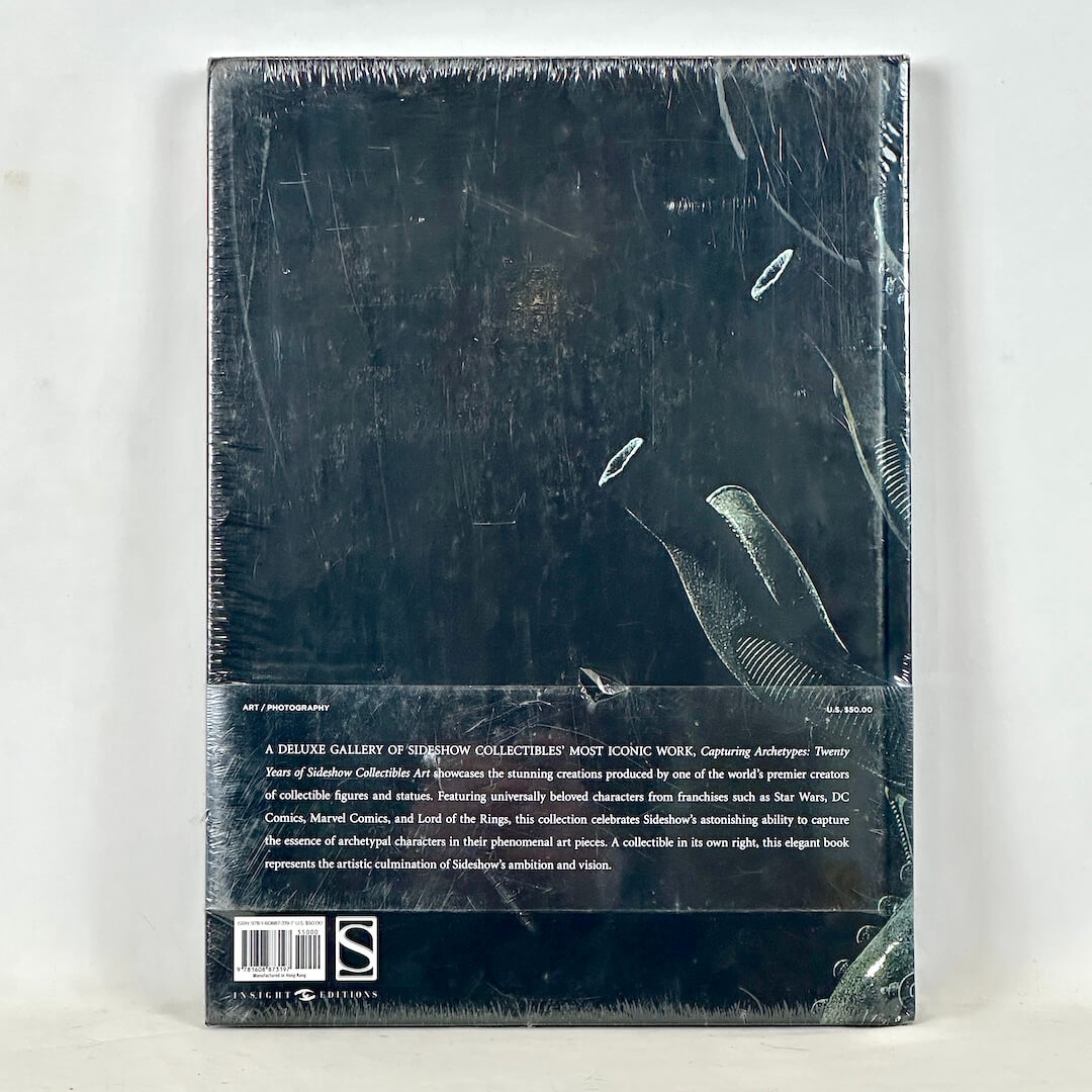 Backside of book cover wrapped in plastic against white background. 