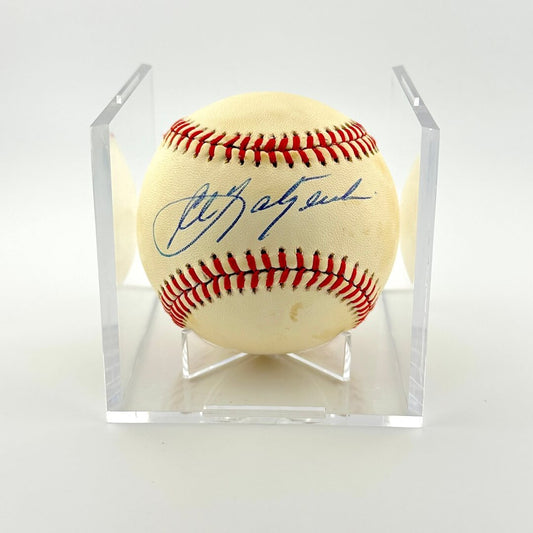 Signed baseball in a clear display case on a white background