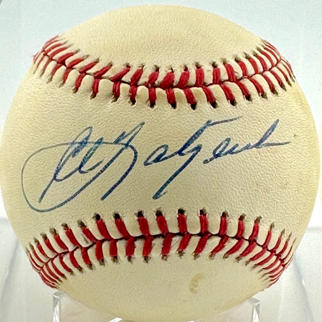 Baseball with a signature on a clear stand