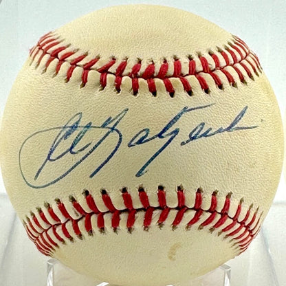 Baseball with a signature on a clear stand