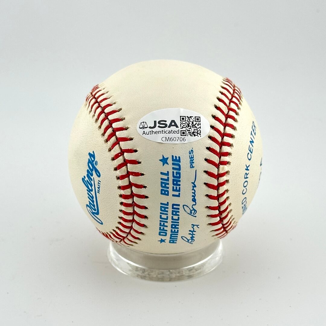 Baseball with Rawlings logo and JSA authentication label on a white background