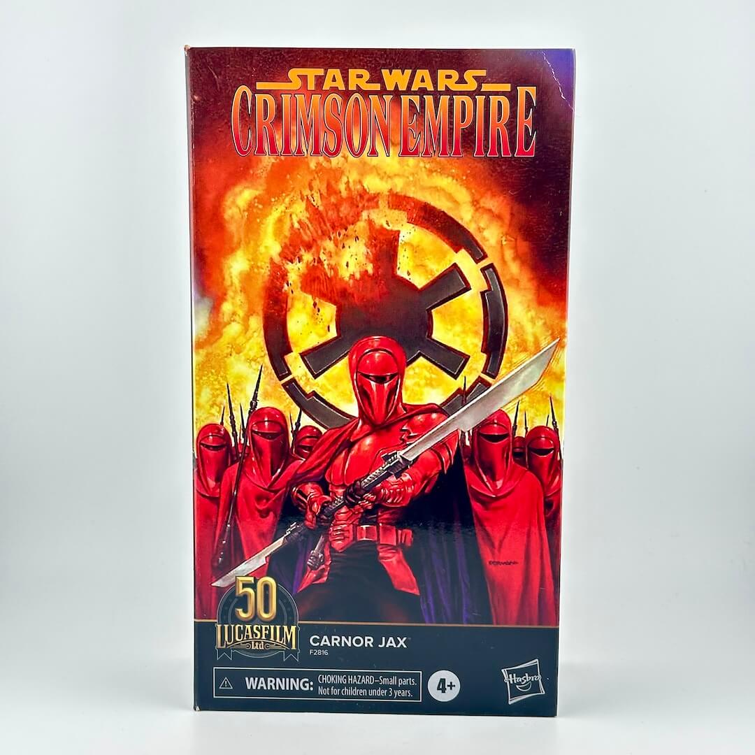 Carnor Jax action figure box, featuring red-armored characters against a fiery orange and black background.