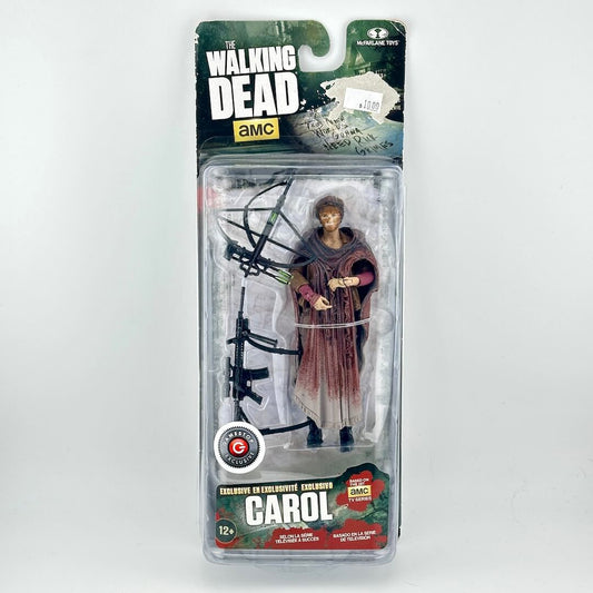 A packaged action figure of Carol from The Walking Dead, shown in its original blister pack with the card backing.
