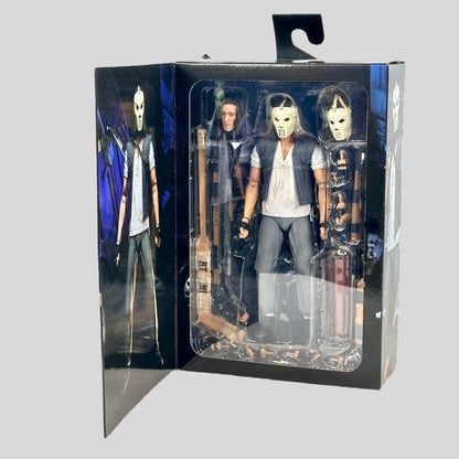 Action figure in packaging with character illustrations on a gray background