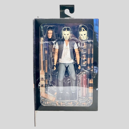Action figure in packaging with a gray background