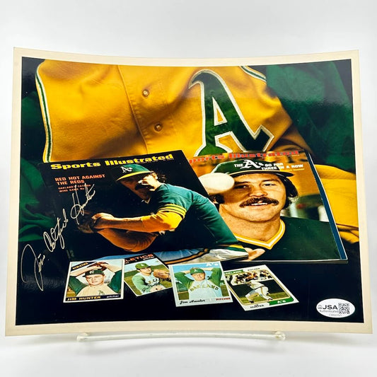 Sports memorabilia photo featuring a baseball player in a yellow and green uniform with 'A's' logo, autographed cards, and a Sports Illustrated cover.