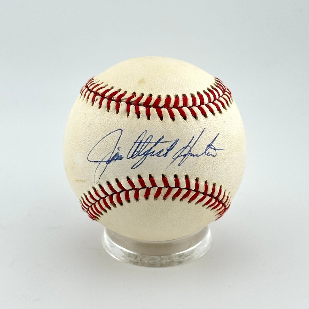 Baseball with autograph on a white background