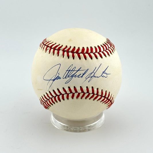 Baseball with autograph on a white background