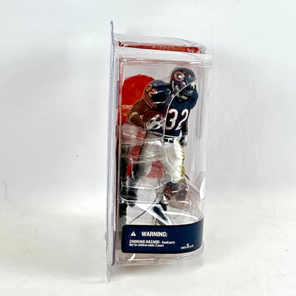 Packaged toy figure of a football player with a clear front on a white background