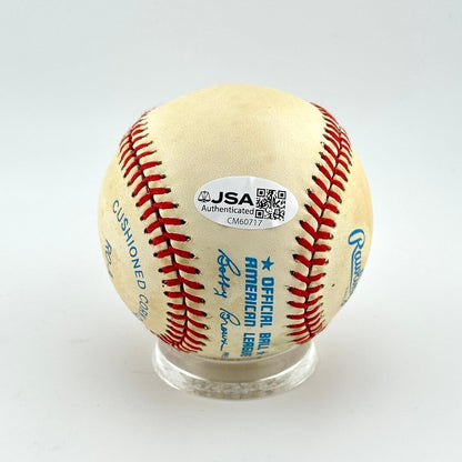 Baseball with JSA authentication label on a white background
