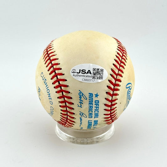 Baseball with JSA authentication label on a white background