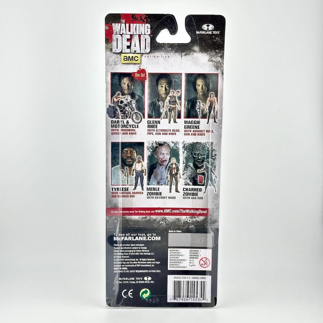 Back of a McFarlane Toys 'The Walking Dead' action figure blister card package, showing multiple character illustrations.