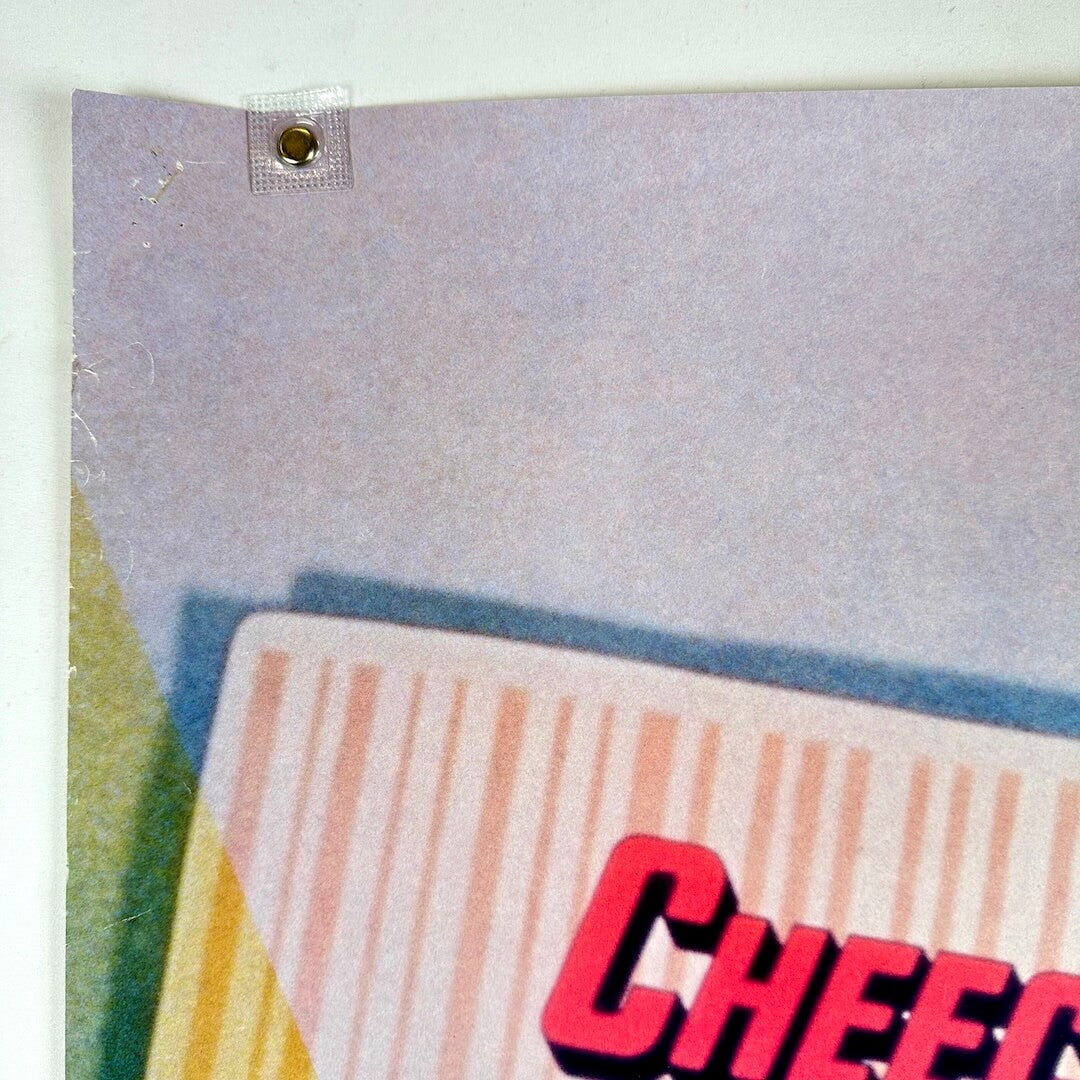 Top left corner of poster with small pin holes