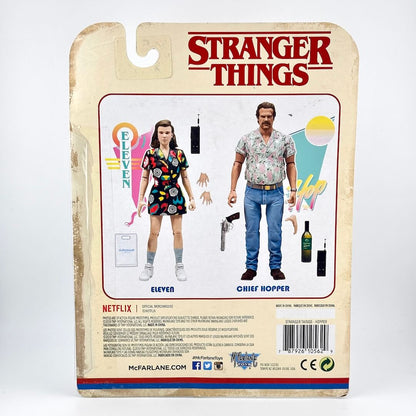 Stranger Things action figure back card showing Eleven and Chief Hopper, with the Stranger Things logo at the top.