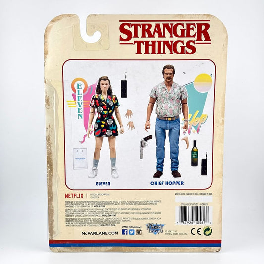 Stranger Things action figure back card showing Eleven and Chief Hopper, with the Stranger Things logo at the top.