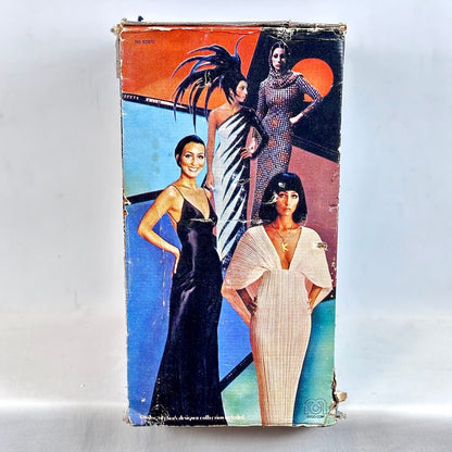 Vintage packaging with images of women in evening gowns on a white background