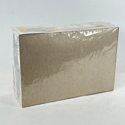 Box with vintage model kit for Chevy Caprice against white background. 