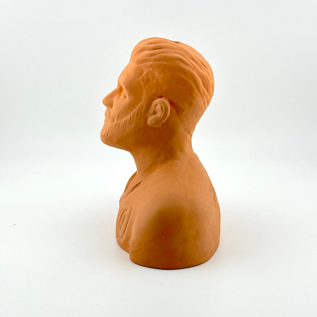 Terracotta-colored bust of a man on a white background