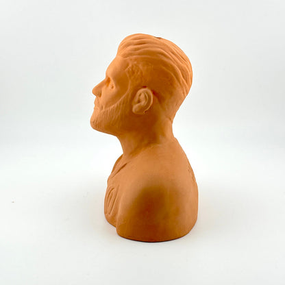 Terracotta-colored bust of a man on a white background