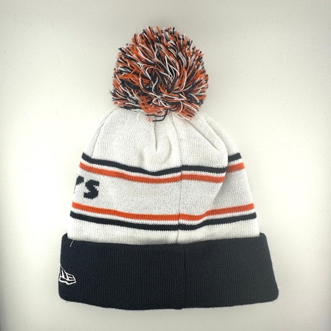 White knit cap with orange/navy stripes around navy text, navy cuff with Bears logo front center & navy/white/orange pom