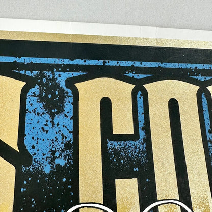 Top center of poster with small creases. 
