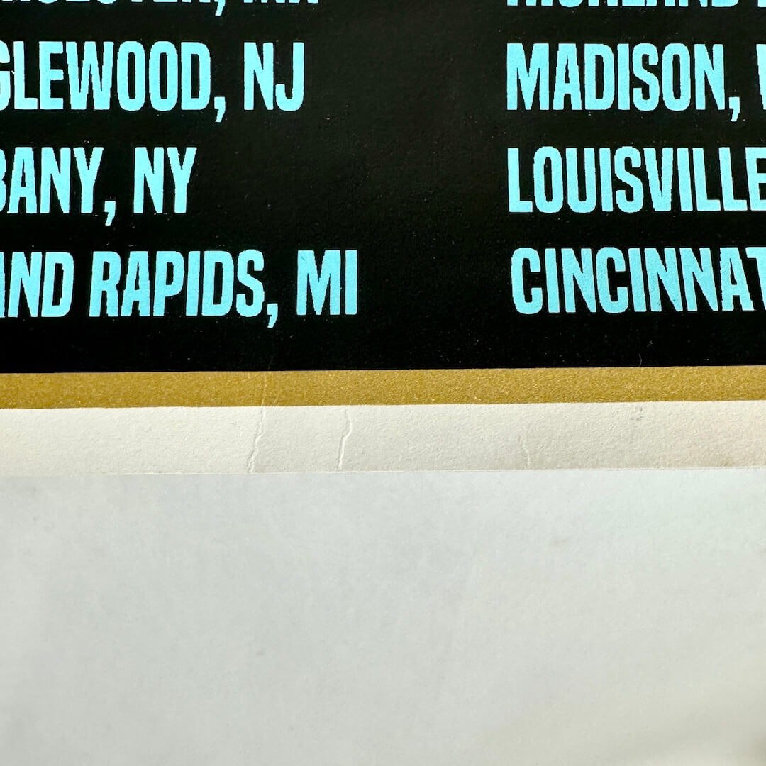 Creases at bottom center of poster. 