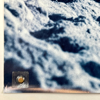 Bottom left corner of poster with small creases. 