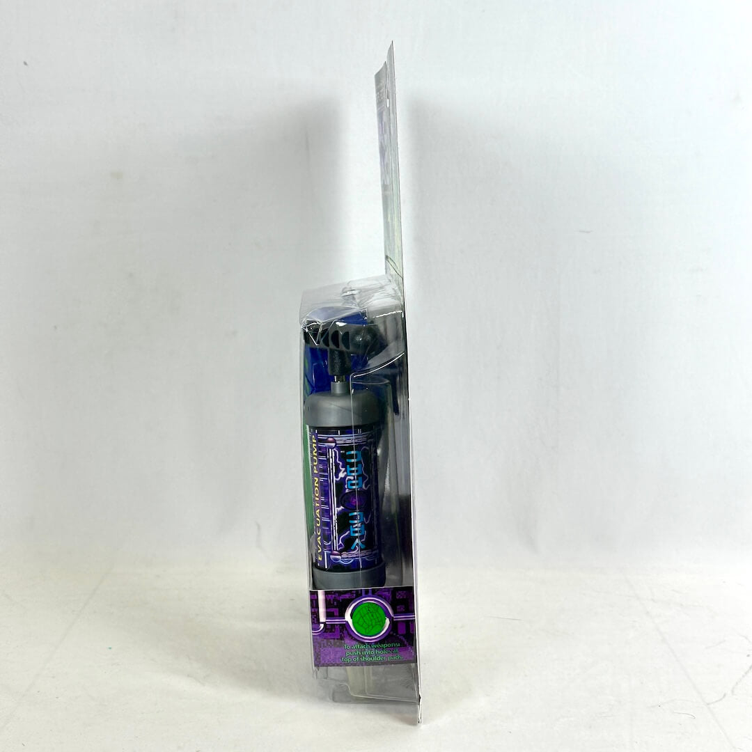 Side view of toy in packaging to show condition against white background. 