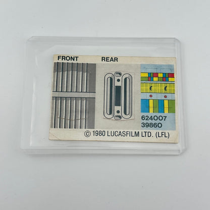 Vintage Lucasfilm Ltd. product label with front and rear views on a beige background, in protective sleeve.